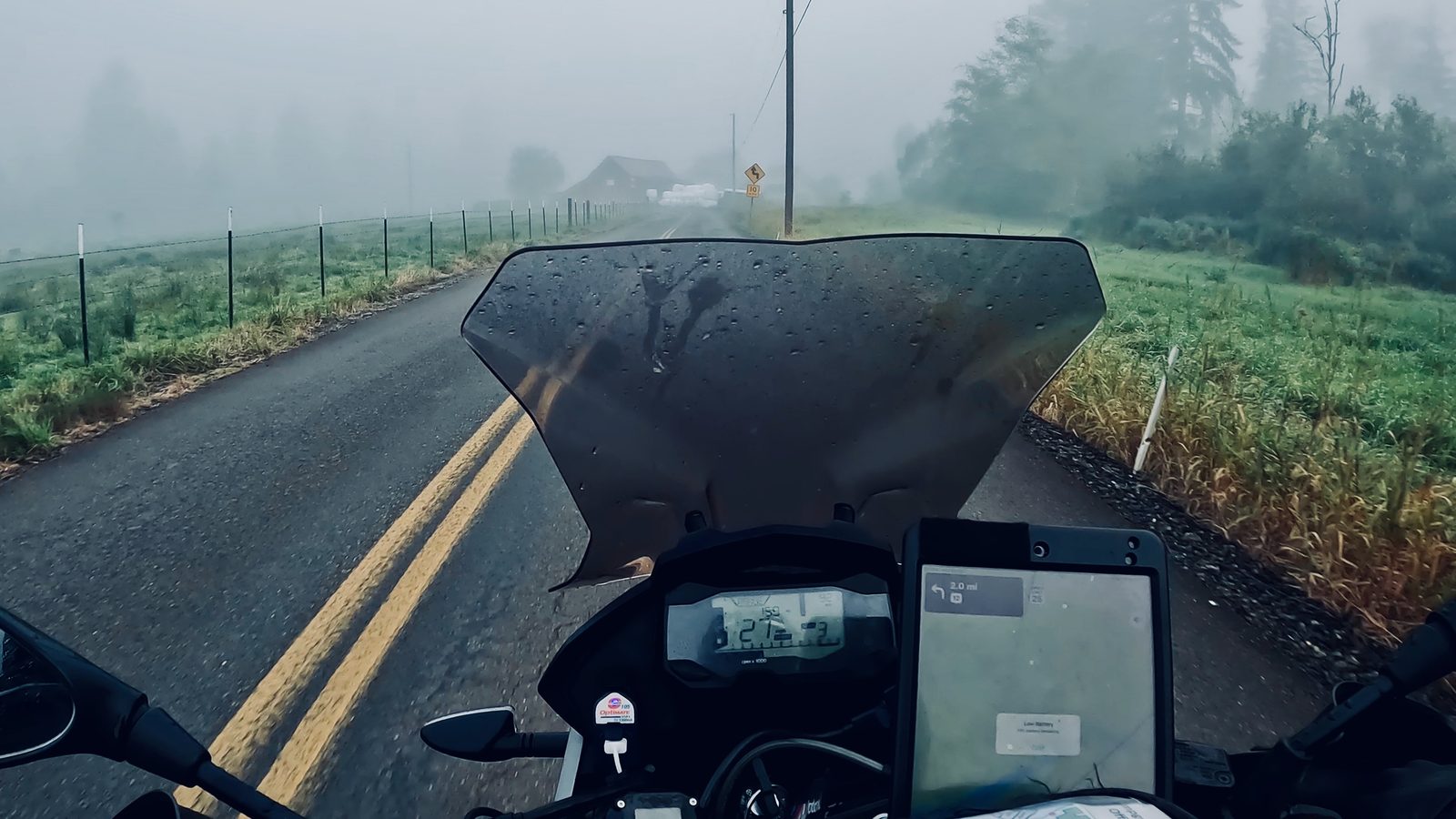 Foggy morning road seen over the handlebars